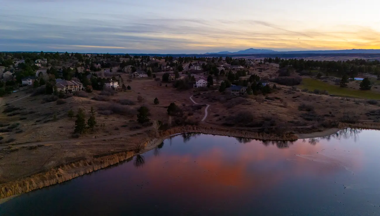 Pink evening clouds reflected in the lake.